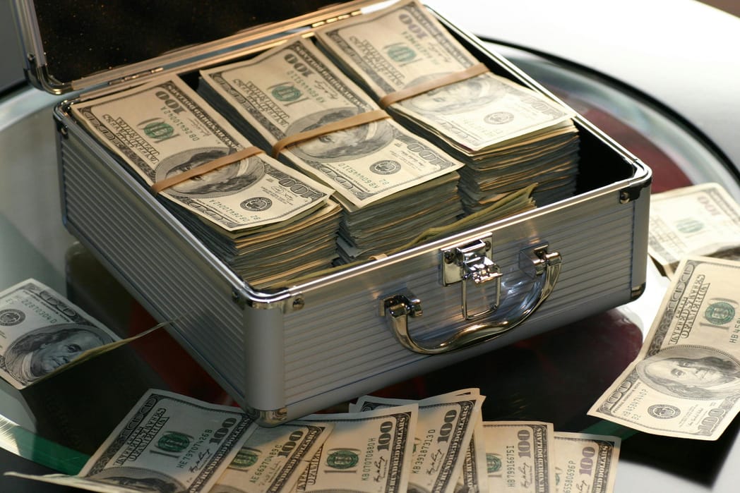 Cash in lockbox, 100 Dollar bills, thegrio.com